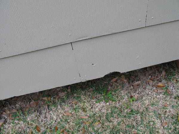 Wind damaged the asbestos siding of this house in Florida